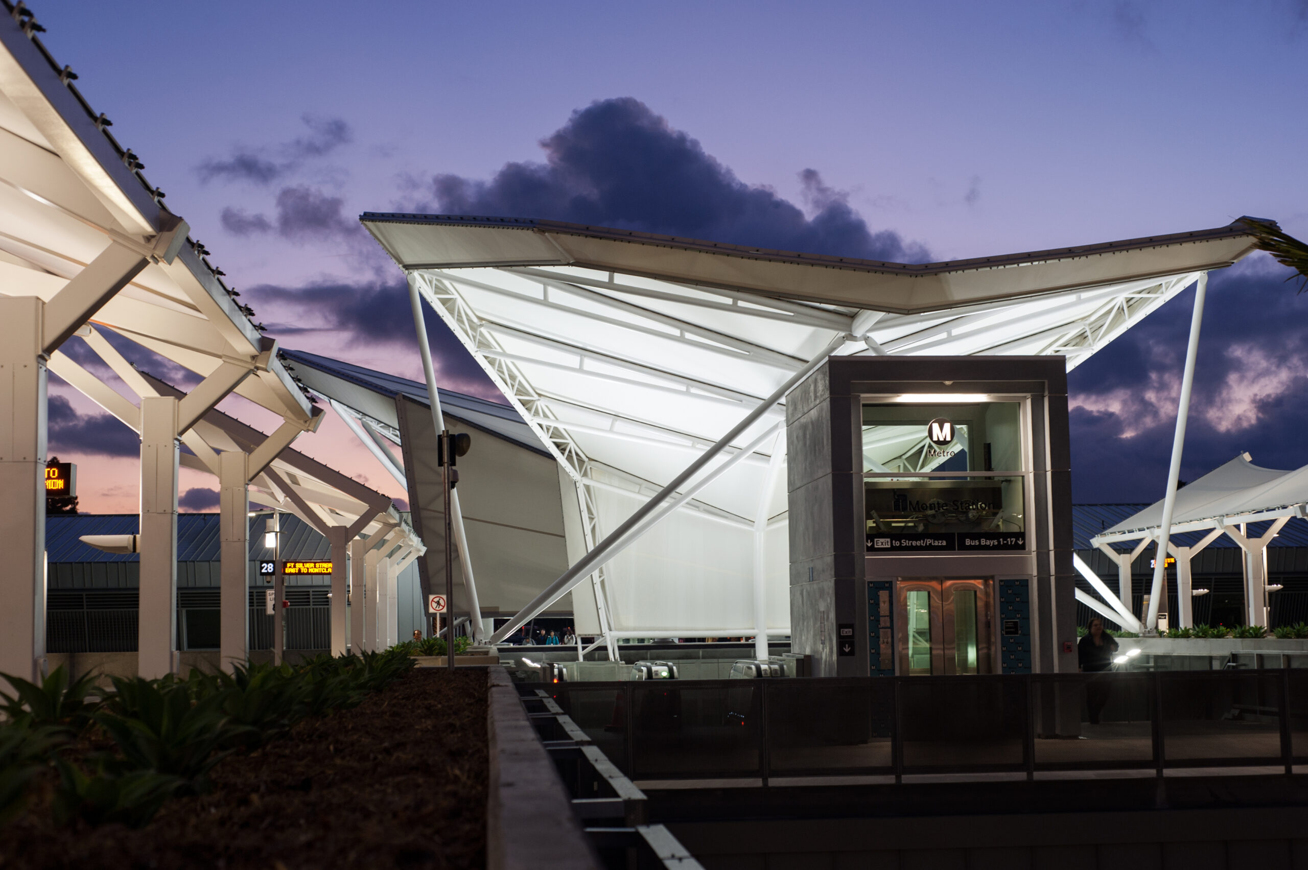 Image of a Metro station with large shade structure at night